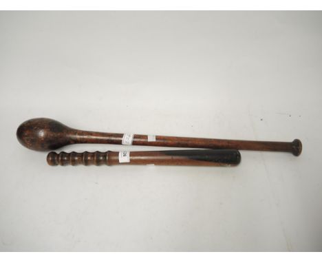 Antique wooden truncheon, together with a hardwood throwing club 