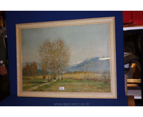 A large framed print of a path leading through a tree lined river valley with mountains in the distance, signed lower right E