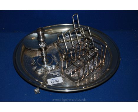 A circular Butler's Tray on ball & claw feet with floral engraving, two Toast Racks, small Candlestick & a wine Taster's Ladl