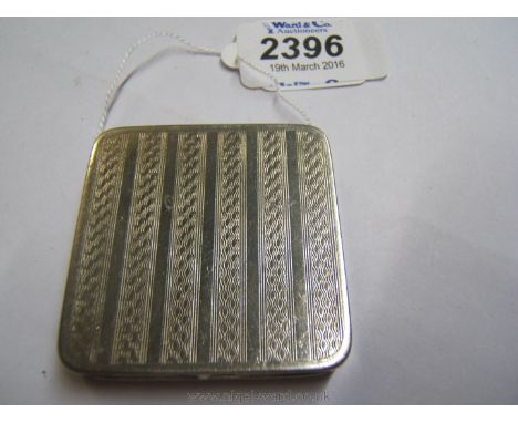 A Lady's Art Deco Stratnoid Powder Compact with engine turned decoration.