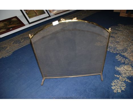 A brass Fireguard.