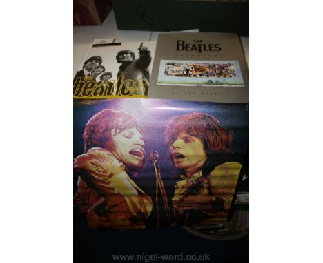 Two Beatles books and a Rolling Stones poster