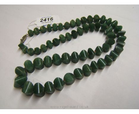 A green Jade graduated bead Necklace, 24'' long.