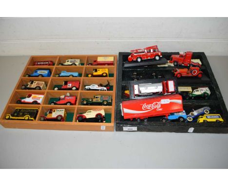 TWO DISPLAY CASES CONTAINING A RANGE OF TOY VANS, FIRE ENGINE ETC