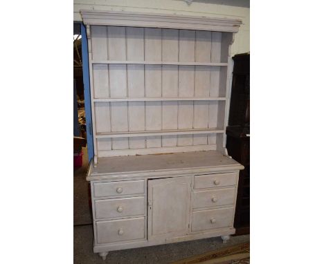 PAINTED PINE DRESSER CABINET WITH THREE SHELF BACK OVER A BASE WITH SIX DRAWERS AND ONE PANELLED DOOR