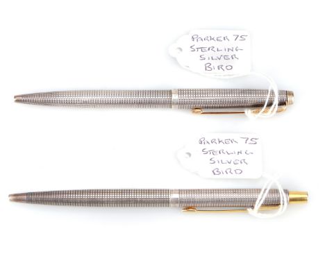 both marked "Sterling Silver", Made in USA, cross hatch design.