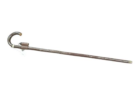 Unusual late 19th century gentlemen’s walking stick with Cherrywood shaft and crook handle, the shaft with a leather bucket c