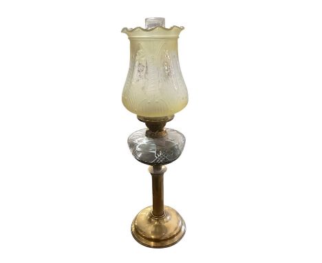 Late Victorian brass oil lamp with a cut glass reservoir and yellow tinted and etched glass shade decorated with cherub's app