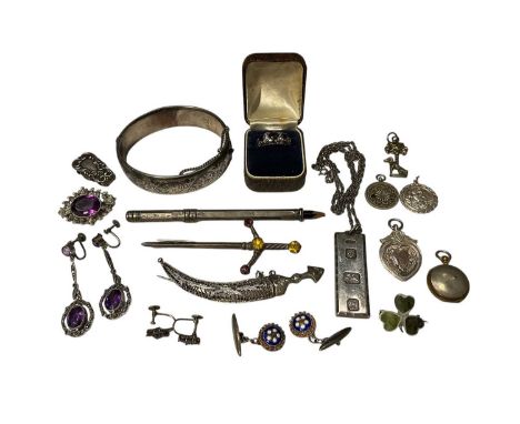 Group of silver and white metal jewellery including a 1960s silver bangle, silver ingot pendant on chain, paste set earrings,