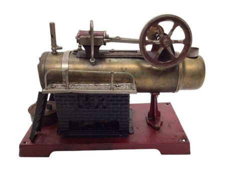 Live steam stationary engine in wooden transit box.