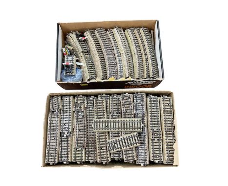 A quantity of Marklin HO gauge rail track with controllers and accessories