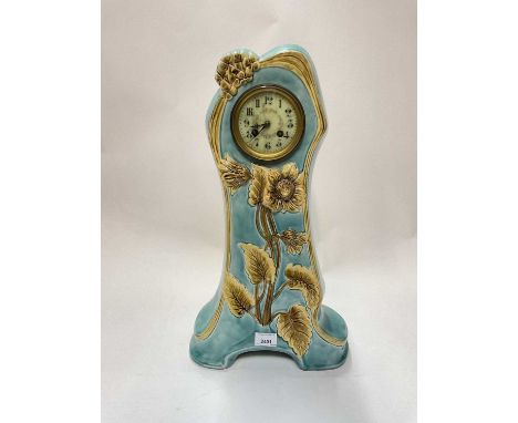 Art Nouveau ceramic clock, painted enamel dial, floral decoration in relief, 54cm high