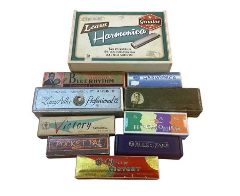 Group of harmonicas, including Hohner, Victory, Echo, etc