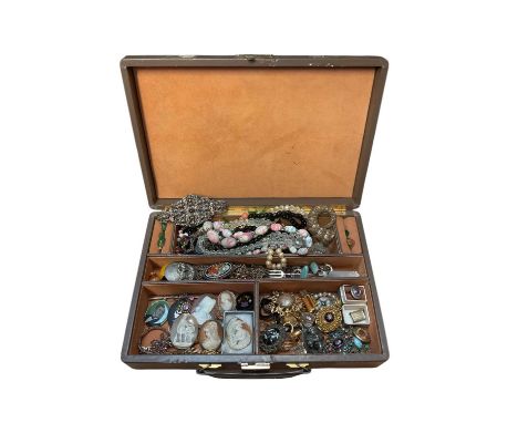 Jewellery case containing various cameos, Victorian gilt metal and enamel oval glazed locket, vintage bead necklaces, gilt me