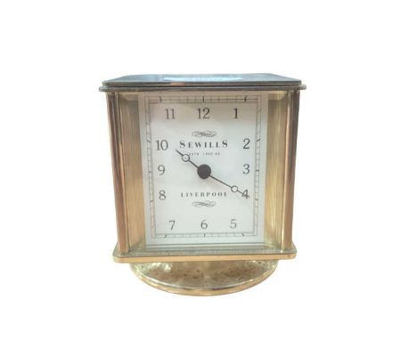 Combination desk clock, barometer, hygrometer and thermometer retailed by Sewill's, Liverpool with quartz movement in four si