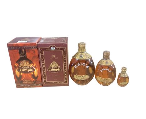 Dimple scotch whisky: three old bottles of graduated size, and two newer in boxes (5)