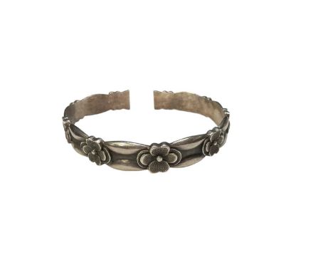 Chinese silver torque bangle with flower head decoration