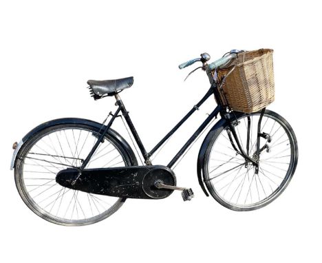 Vintage Sunbeam bicycle in black painted finish with white wartime black out type paint to rear mudguard and wicker shopping 