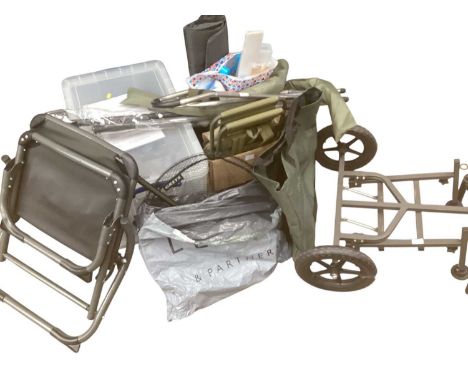 Group of fishing equipment including folding chairs, nets, hats, books, scales, bags, etc