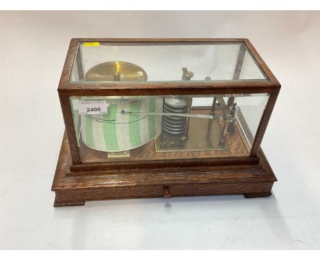 An oak-cased brass barograph, 36cm wide