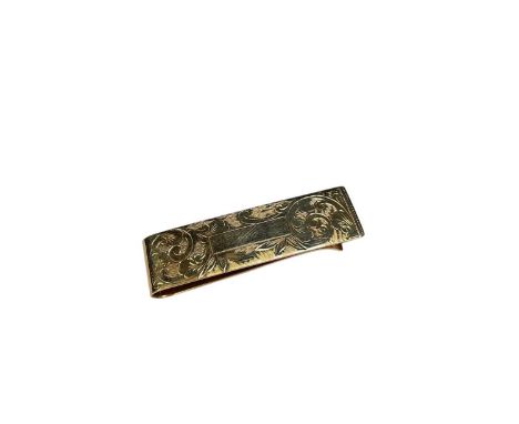 9ct gold money clip with engraved floral scroll decoration, 5cmLondon hallmarks. Weight 9.5 grams