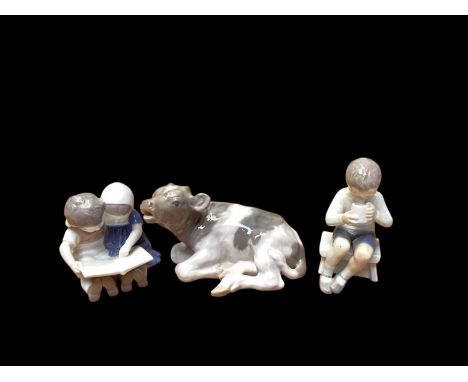 Royal Copenhagen model of a calf, no.1072, together with two Bing &amp; Grondahl figures 1713 and 1567 (3)