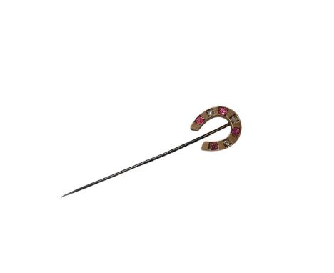 Horseshoe stick pin set with rose cut diamonds and pink stones, 6.7cm long The horseshoe is unmarked. The pin fitting is not 