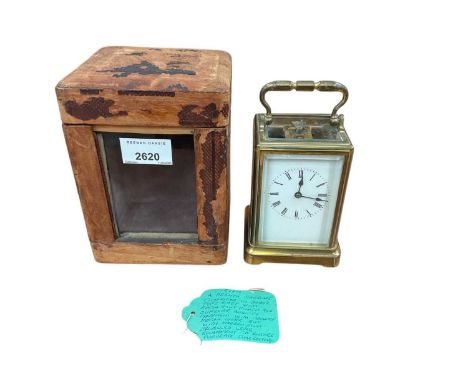 Late 19th century French brass carriage clock, in attractive gorge case with white enamel dial, associated travel case