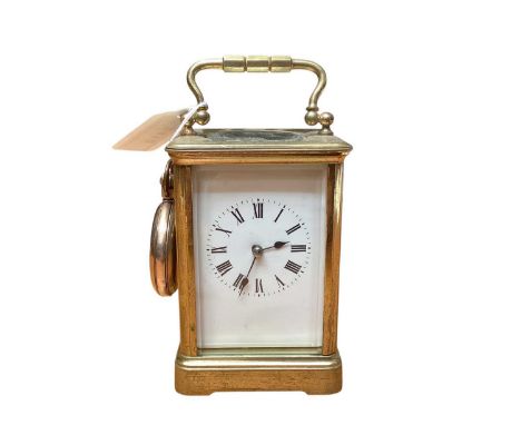 Brass striking carriage clock together with a Waltham gold plated pocket watch (2)