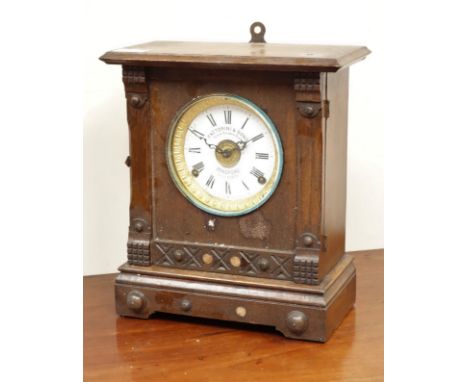 Early 20th century oak cased mantel clock, white enamel dial signed 'attorini & Sons Bradford', H32cm    Condition Report   C