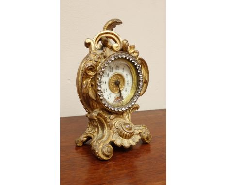 Late 19th ormolu clock, scrolling foliage and flower head decoration, H15cm   Condition Report   Click here for further image