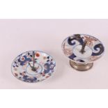A porcelain Imari dish on a silver handle, China, 18th century.