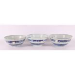 Three blue/white porcelain bowls on stand ring, China, 1817.