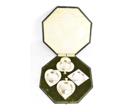 A set of four Edwardian silver novelty dishes, by Henry Matthews, hallmarked Birmingham 1909, formed as playing card suits de