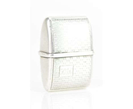 An early 20th century American sterling silver vesta case, the engine turned case having a cartouche engraved with initials, 