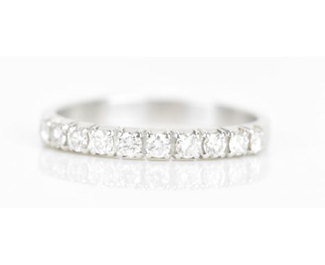 A diamond 18ct white gold half eternity ring, having ten brilliant cut diamonds, each measuring approximately 1.8mm, stamped 