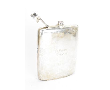 A George V silver hip flask, by Stewart Dawson & Co, hallmarked Chester 1918, of curved form, engraved to the front "R.Shaw A