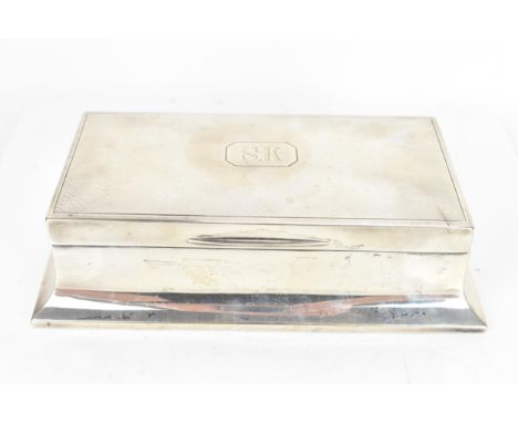 An early 20th century silver cigarette box, by Walker & Hall, date letter rubbed, having an engine turned lid engraved with i