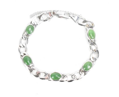 An 18ct white gold jade set bracelet, having curb chain links with five jade cabochons, certificate of guarantee stating 8.2c