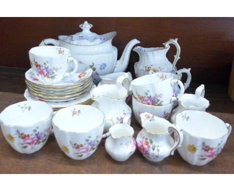 A collection of Royal Crown Derby Posies including five jugs, a tea service with tea pot, sugar bowl, milk jug, six cups, sau