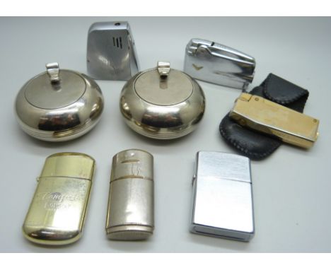 A collection of lighters including Ronson Atomic 1950s, Ronson Gold, Tempest, Kingsway A Pioneer, a Cyclona etc. and three tr