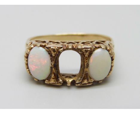 A 9ct gold and opal ring, lacking one stone, 4.1g, S
