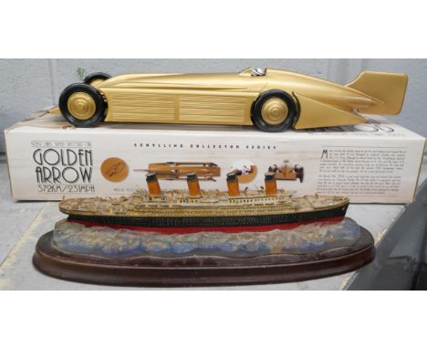 A Schylling Collector Series 1929 Land Speed Record Car, Golden Arrow, and a model of The Titanic