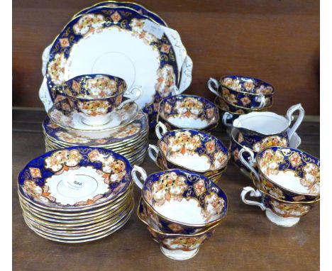 A Royal Albert Heirloom tea set, 12 cups, 11 saucers, 12 side plates, (39 pieces in total)