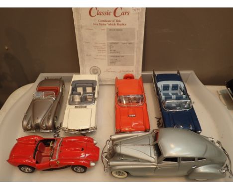 Six Danbury Mint 1/24 scale models including 1957 Chevrolet Bel Air convertible 1956 Thunderbird convertible 1933 Pierce Silv