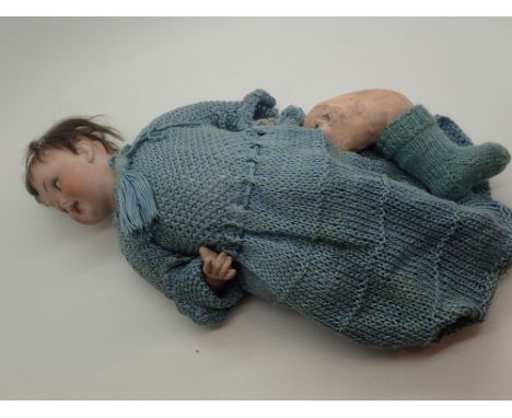 Antique ceramic head doll with impressed German mark to back of neck open mouth with teeth papier mache body and limbs and sl