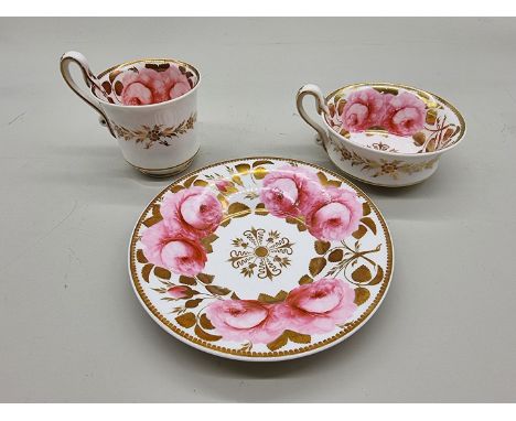 An early 19th century H &amp; R Daniel porcelain trio, finely painted with pink roses.&nbsp; 