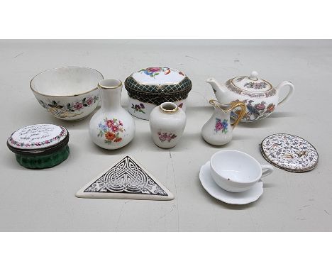 A small Russian porcelain teacup, together with an 18th century enamel patchbox; and other items. 