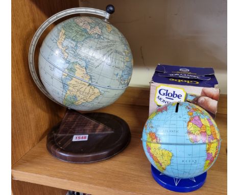 A Chad Valley globe clock,&nbsp;28cm high; together with a Chad Valley globe moneybox, boxed. (2) 