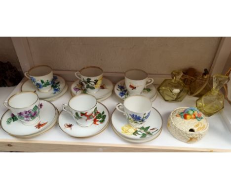 A set of six Berlin porcelain trios, each with printed decoration; together with an Echt Kristall glass dressing table set; a